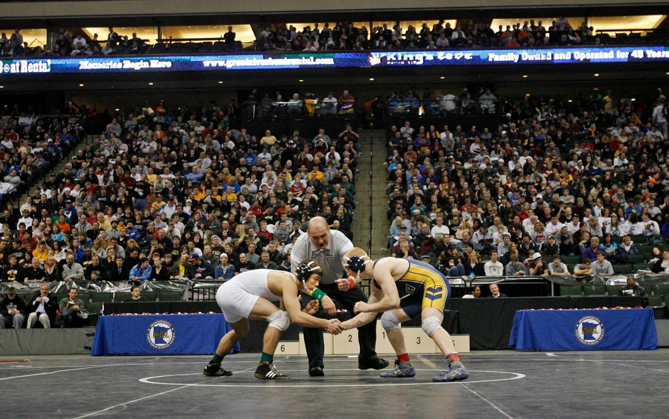 DAVID JOLES â€¢ djoles@startribune.com -March 5, 2011- St. Paul, MN- Finals of the Minnesota State High School Association wrestling meet at the Xcel Energy Center in St. Paul. In this photo:] Apple Valley's Destin McCauley, left, won his fifth title with a pin in the first round of AAA at 152 pounds against Adam Jacskon of Rosemount.