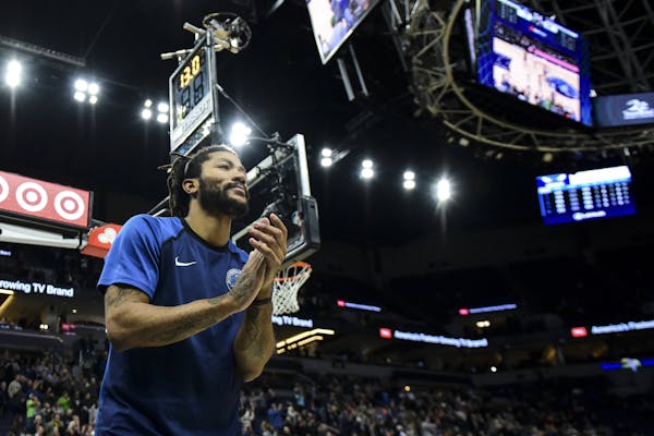 Minnesota Timberwolves guard Derrick Rose (25) celebrated his team's victory in the final seconds of the fourth quarter against the Charlotte Hornets.