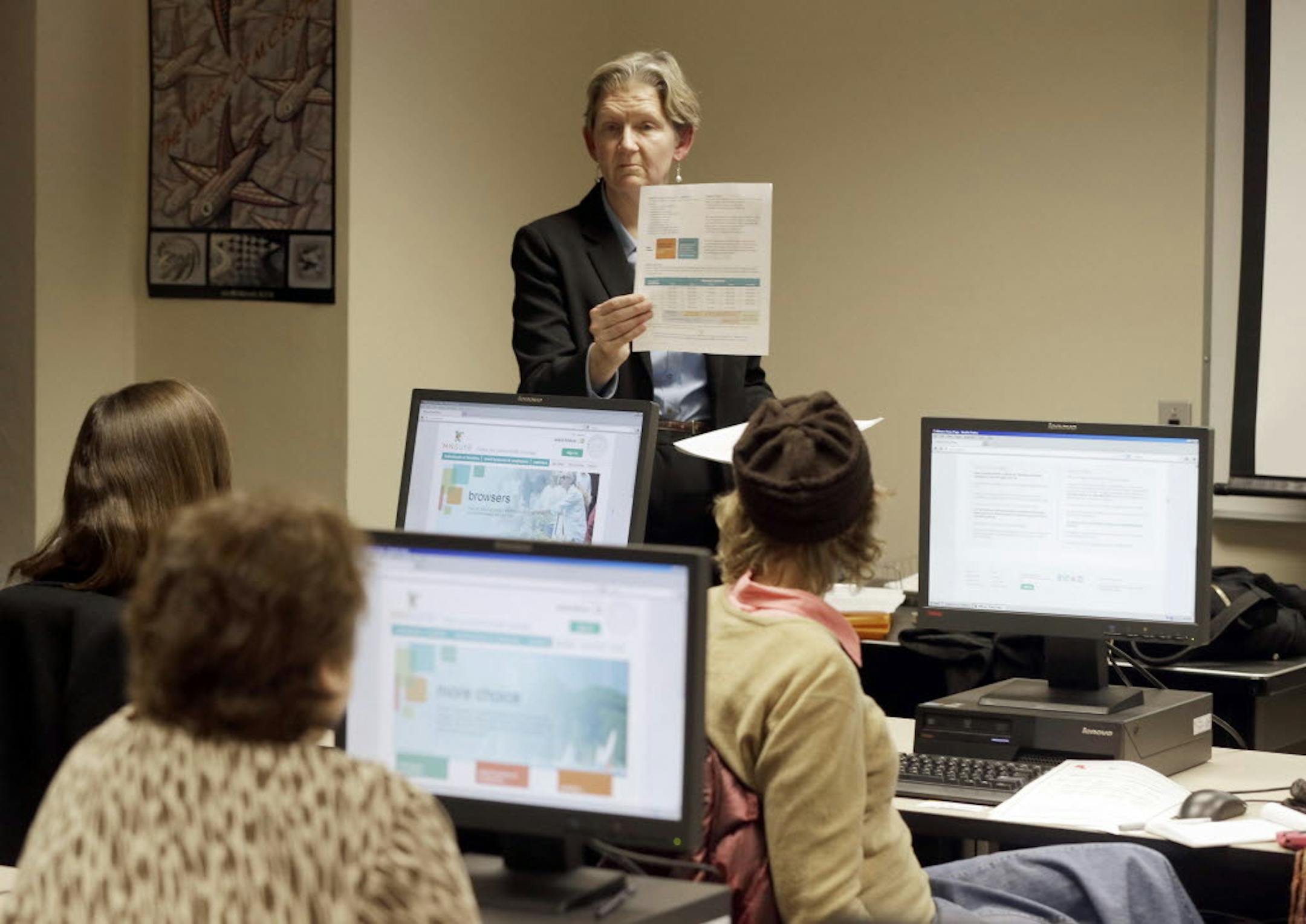 Nov. 13, 2013: Maureen O'Connell addresses people in attendance at the "MNsure Crash Course" at the St. Paul Library to help them understand how federal health care reform affects their lives.