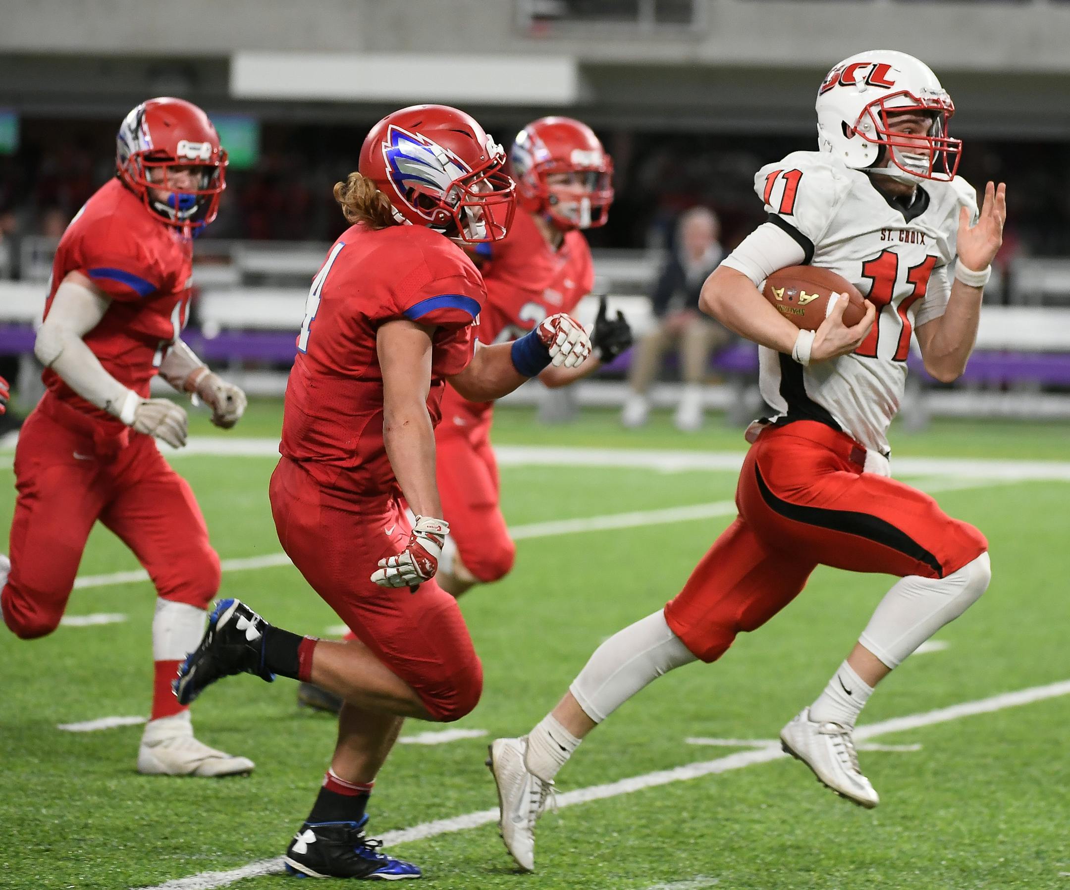 St. Croix Lutheran quarterback Jonathan Liesener (11) ran the ball for a first down in the third quarter against Pequot Lakes. ] AARON LAVINSKY ï aaron.lavinsky@startribune.com St. Croix Lutheran played Pequot Lakes in a Class 3A State Tournament semifinal game on Saturday, Nov. 18, 2017 at US Bank Stadium, in Minneapolis, Minn.