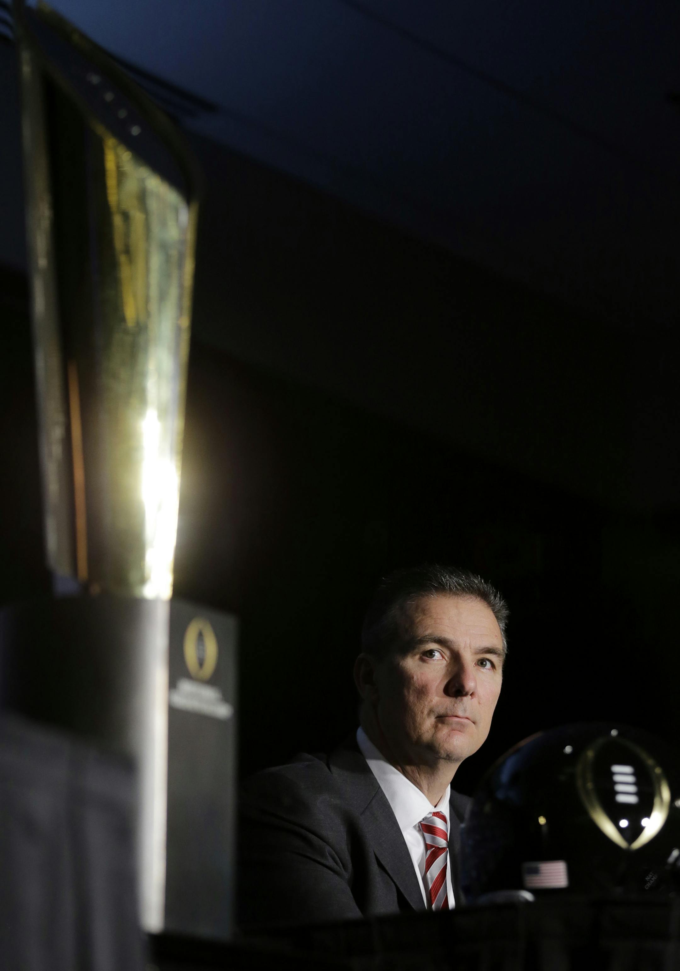 Ohio State head coach Urban Meyer listens to a question during a news conference before the NCAA college football playoff championship game Sunday, Jan. 11, 2015, in Dallas. Oregon plays Ohio State in the championship game on Monday. (AP Photo/Eric Gay)