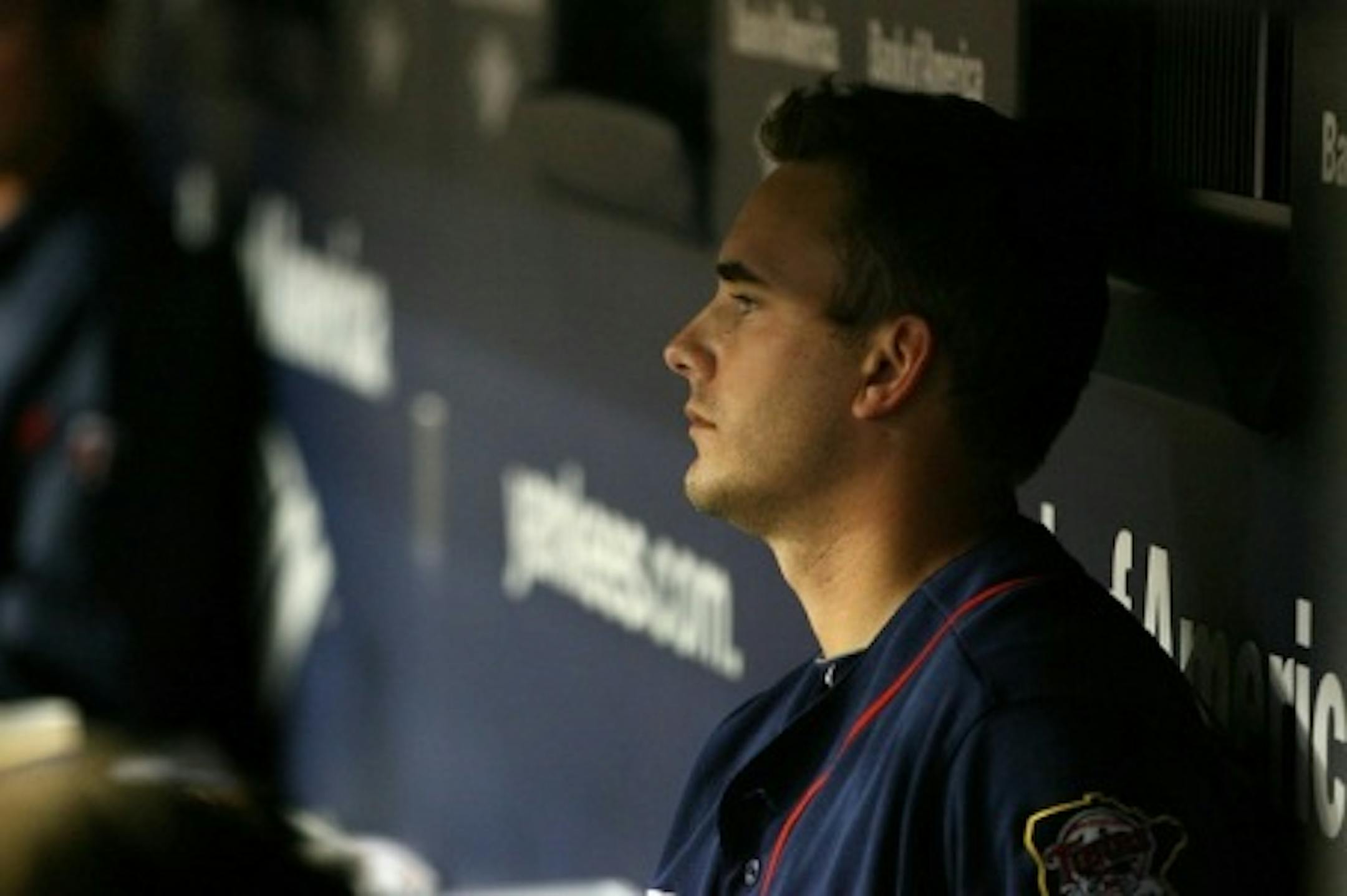 NEW YORK - OCTOBER 09:  Starting pitcher Brian Duensing #52 of the Minnesota Twins sits in the dugout dejected after he was taken out of the game against the New York Yankees during Game Three of the ALDS part of the 2010 MLB Playoffs at Yankee Stadium on October 9, 2010 in the Bronx borough of New York City.  (Photo by Andrew Burton/Getty Images)