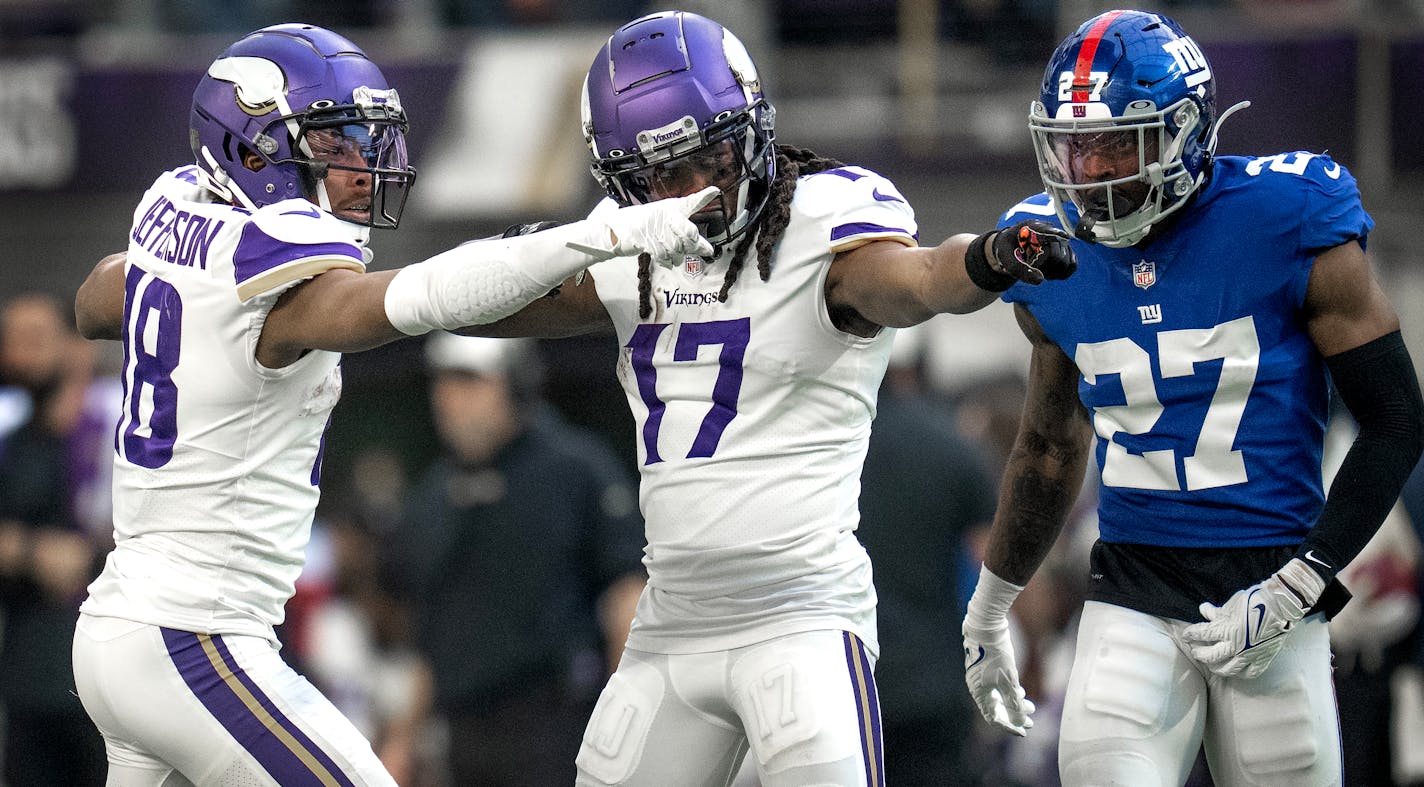 Minnesota Vikings wide receiver Justin Jefferson (18) celebrates a first down catch with K.J. Osborn (17) in the third quarter in Minneapolis, Minn., Saturday December 24, 2022.