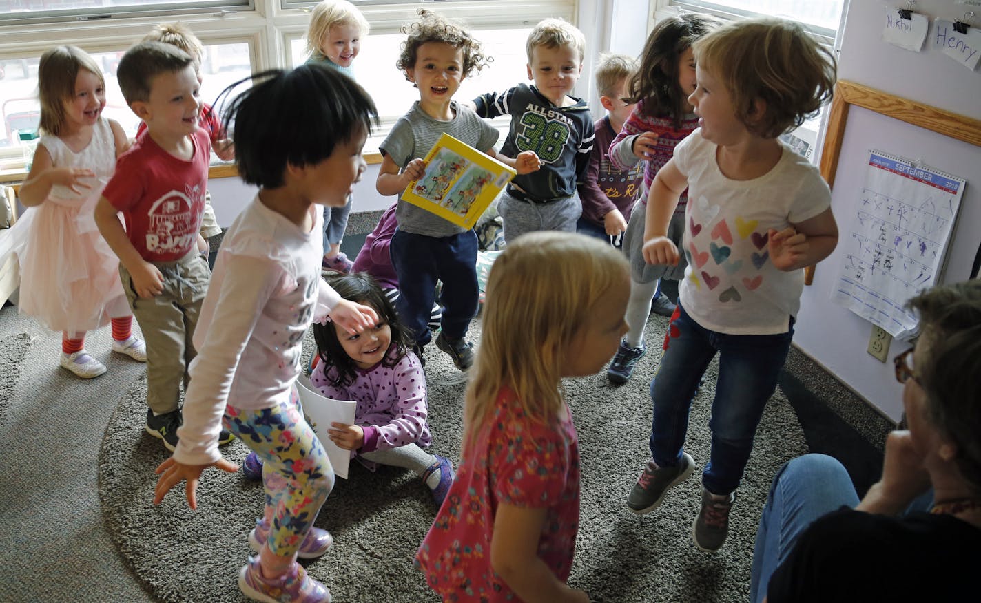 Children gathered and listened as teacher Kelli Kern read a book aloud. Kern, who has worked at the Child Development Center for 30 years, said, "If you want to be in the field, this is the best place to be." ] Shari L. Gross &#x2022; shari.gross@startribune.com Just days after the University of Minnesota announced it would scrap plans to close its child care center after an outcry from parents, families are rallying to oppose a plan to close the Child Development Center. The university wants to