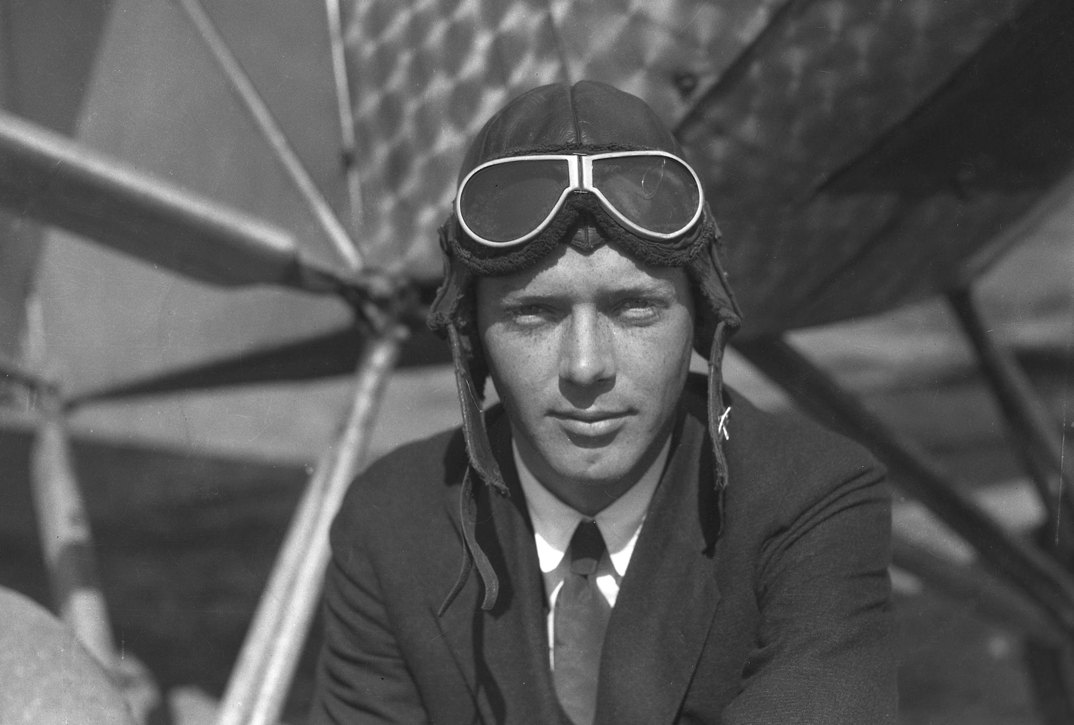 In this March 1, 1927, photo, Charles A. Lindbergh poses for a photo in front of a Ryan monoplane in San Diego, Calif. Photos tucked away for 90 years in a California newspaper's archives portray Charles Lindbergh just weeks before he made the first-ever nonstop solo airplane flight across the Atlantic Ocean. (Stanley Andrews Jr./The San Diego Union-Tribune via AP) ORG XMIT: CADIU201