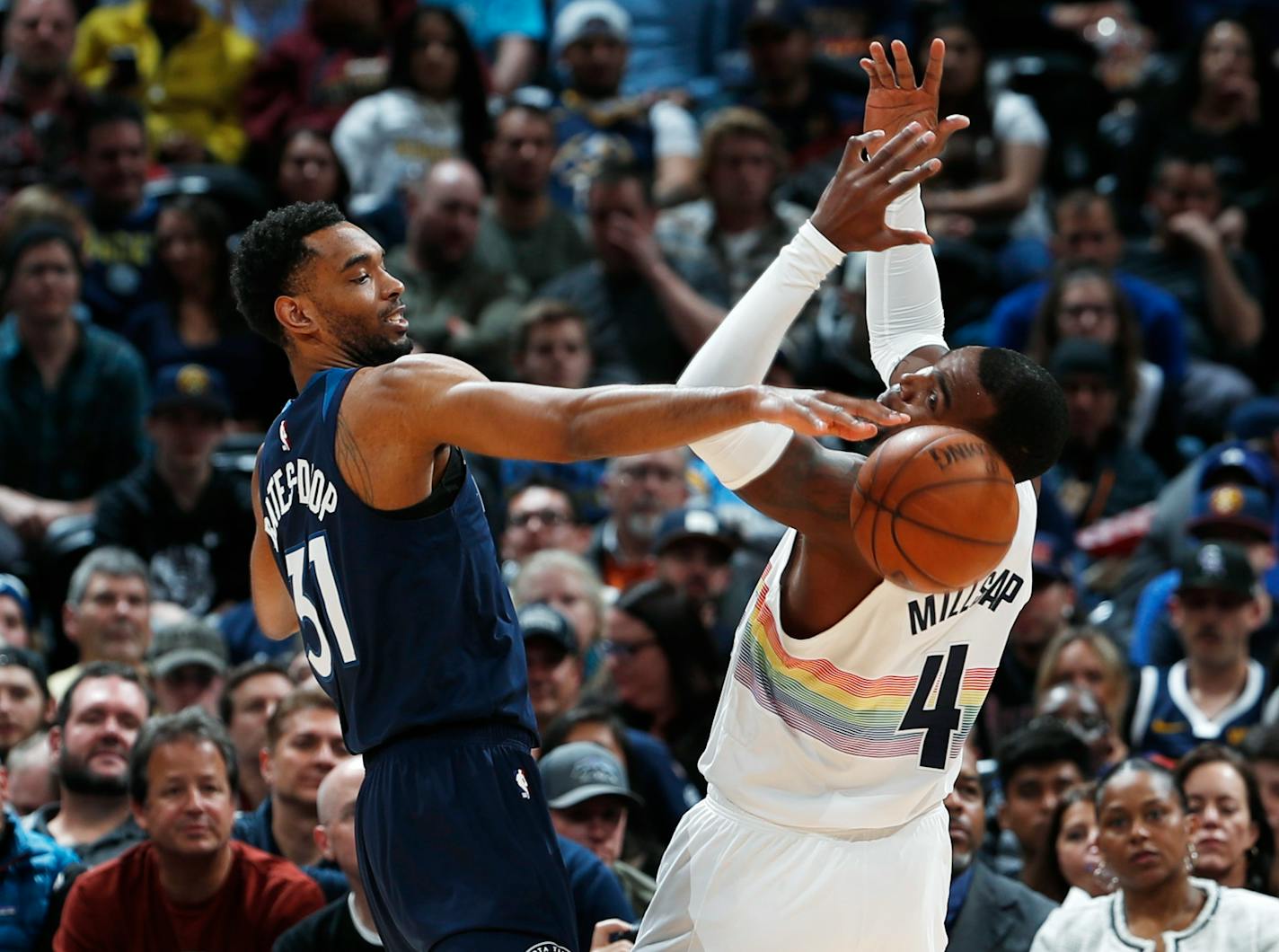 Timberwolves forward Keita Bates-Diop, left, stole the ball from Nuggets forward Paul Millsap during the first half Wednesday.