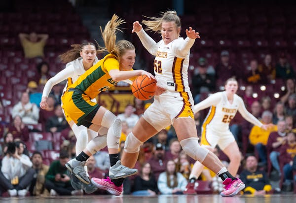 Center Sophie Hart, seen defending against North Dakota State guard Heaven Hamling March 29, has scored in double figures in all four WNIT games and h