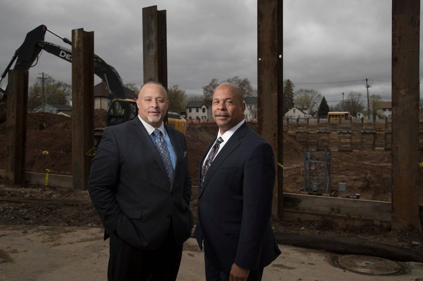 Former chief executive Ravi Norman left, and founder Richard Copeland of Thor Cos. stand outside of the company's new headquarters as it was being built in 2017.