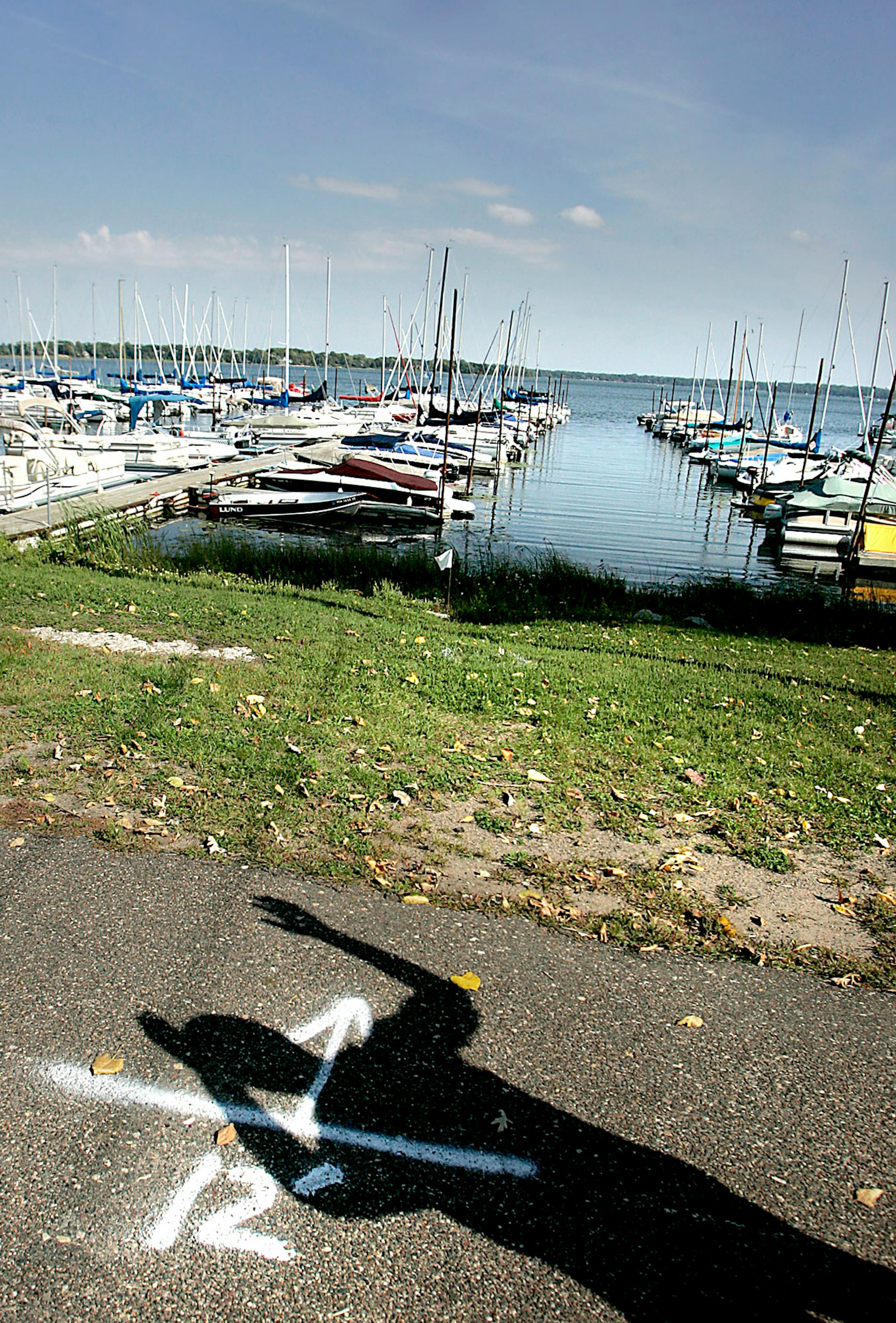 Mayor Paul Auger talked about how the city of White Bear Lake plans to utilize boat marina space as he casts a shadow on the trail that the city plans to widen.