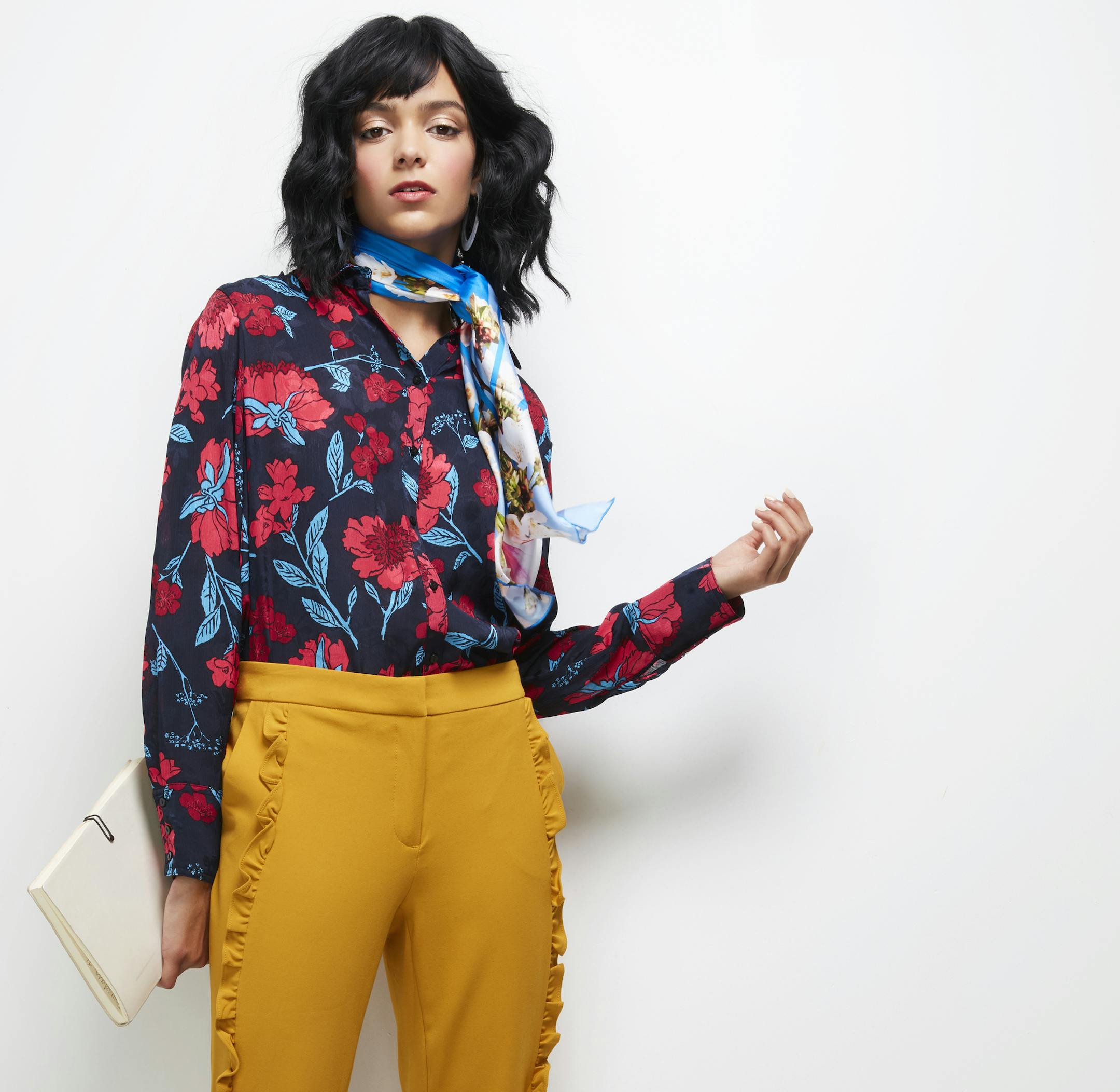 Chrysanthemum Floral blouse $46 zara.com Ruffled pants $17 tjmaxx.com
Ted Baker scarf $125 nordstrom.com
Earrings $10 nordstromrack.com Photographer Lauren Krysti Creative Director and Stylist Barbara Schmidt, studiobstyle
Hair and Make-up Artist Fatima Olive
Model Megan Keefe, Ignite Models