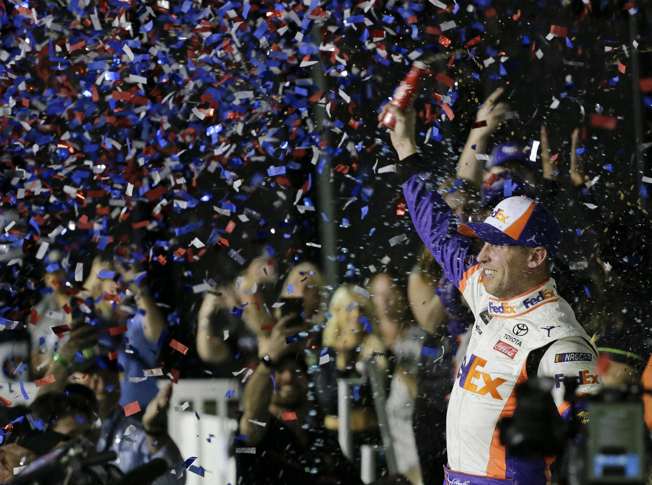 Denny Hamlin celebrates in Victory Lane after winning the NASCAR Daytona 500 auto race at Daytona International Speedway, Sunday, Feb. 17, 2019, in Daytona Beach, Fla. (AP Photo/Terry Renna)