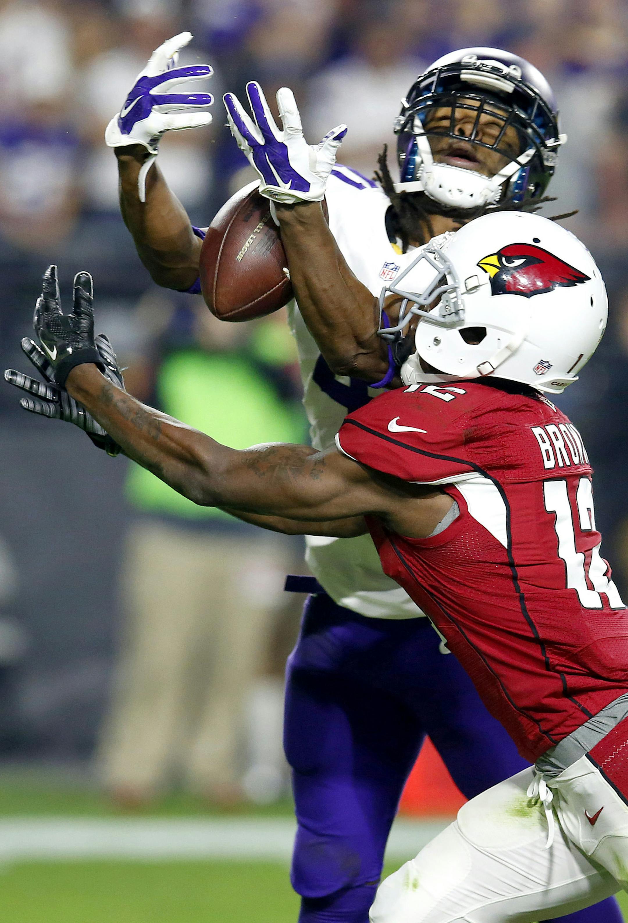 Minnesota Vikings Anthony Harris breaks up a pass intended for Arizona Cardinals wide receiver John Brown (12) during the second half of an NFL football game, Thursday, Dec. 10, 2015, in Glendale, Ariz. (AP Photo/Rick Scuteri) ORG XMIT: MIN2015121719215359