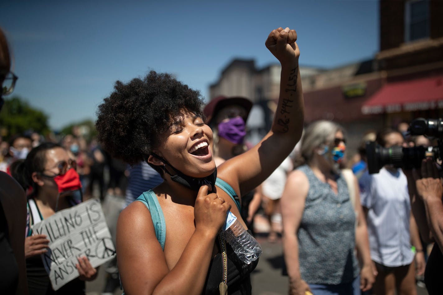 During a rally at 38th St. and Chicago Av. in south Minneapolis on Wednesday, Ireland McAbee of Eau Claire, Wis., raised her fist in celebration of the news that Attorney General Keith Ellison had upgraded charges in the death of George Floyd.