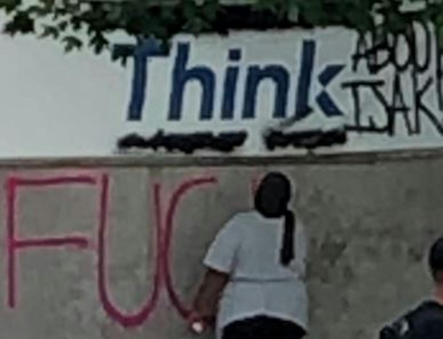 Police in Eagan released a photo of a woman tagging a wall with graffiti. They are seeking the public's help in locating those responsible for the vandalism.