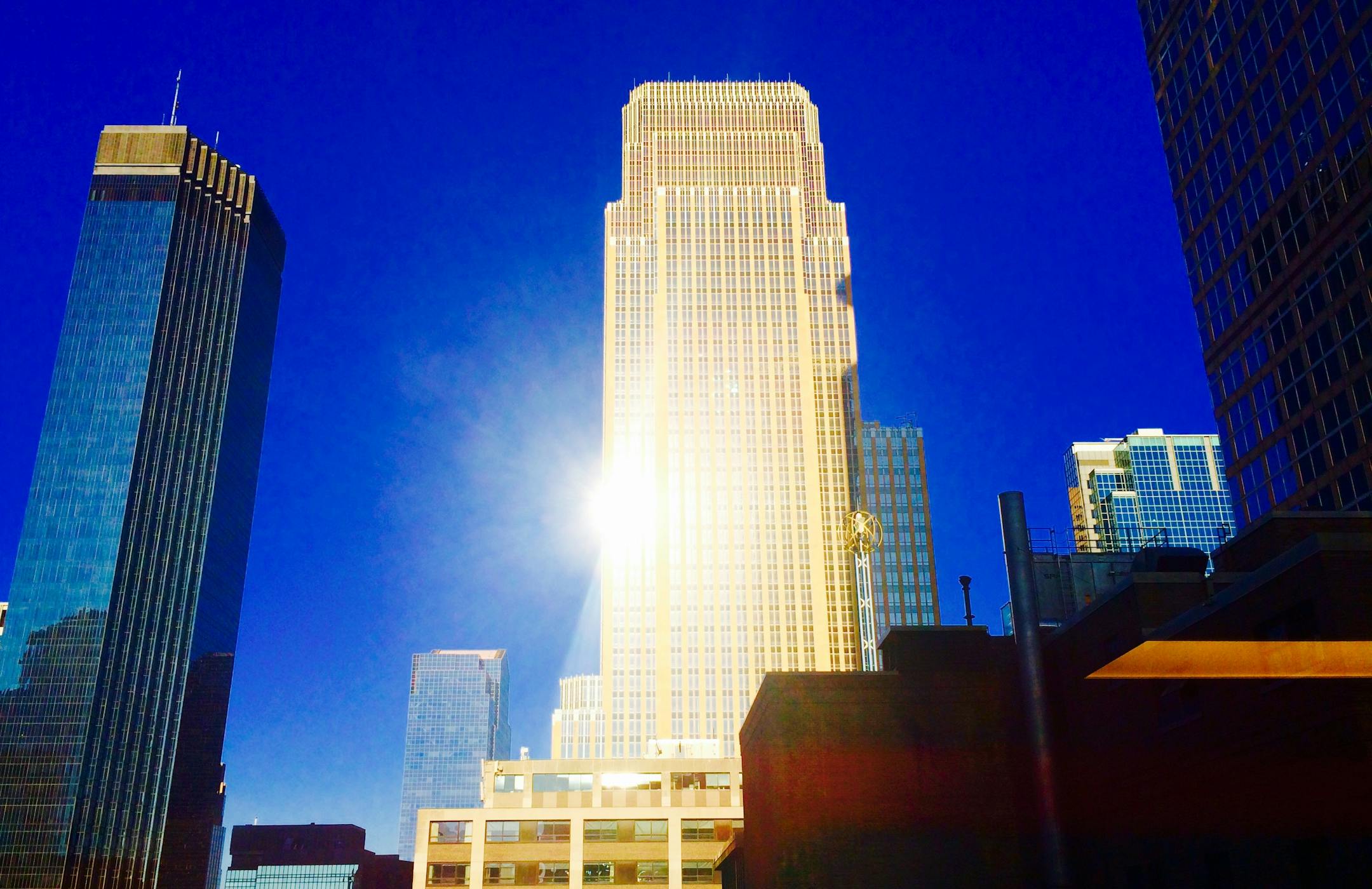 The tall buildings of Minneapolis caught the morning sun Sunday morning.