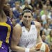 Minnesota Lynx center Janel McCarville (4) protects the ball against Los Angeles Sparks center Jantel Lavender (42) in the second half of a WNBA baske