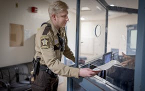 Hennepin County jail deputy Matthew Durette makes his rounds last month.