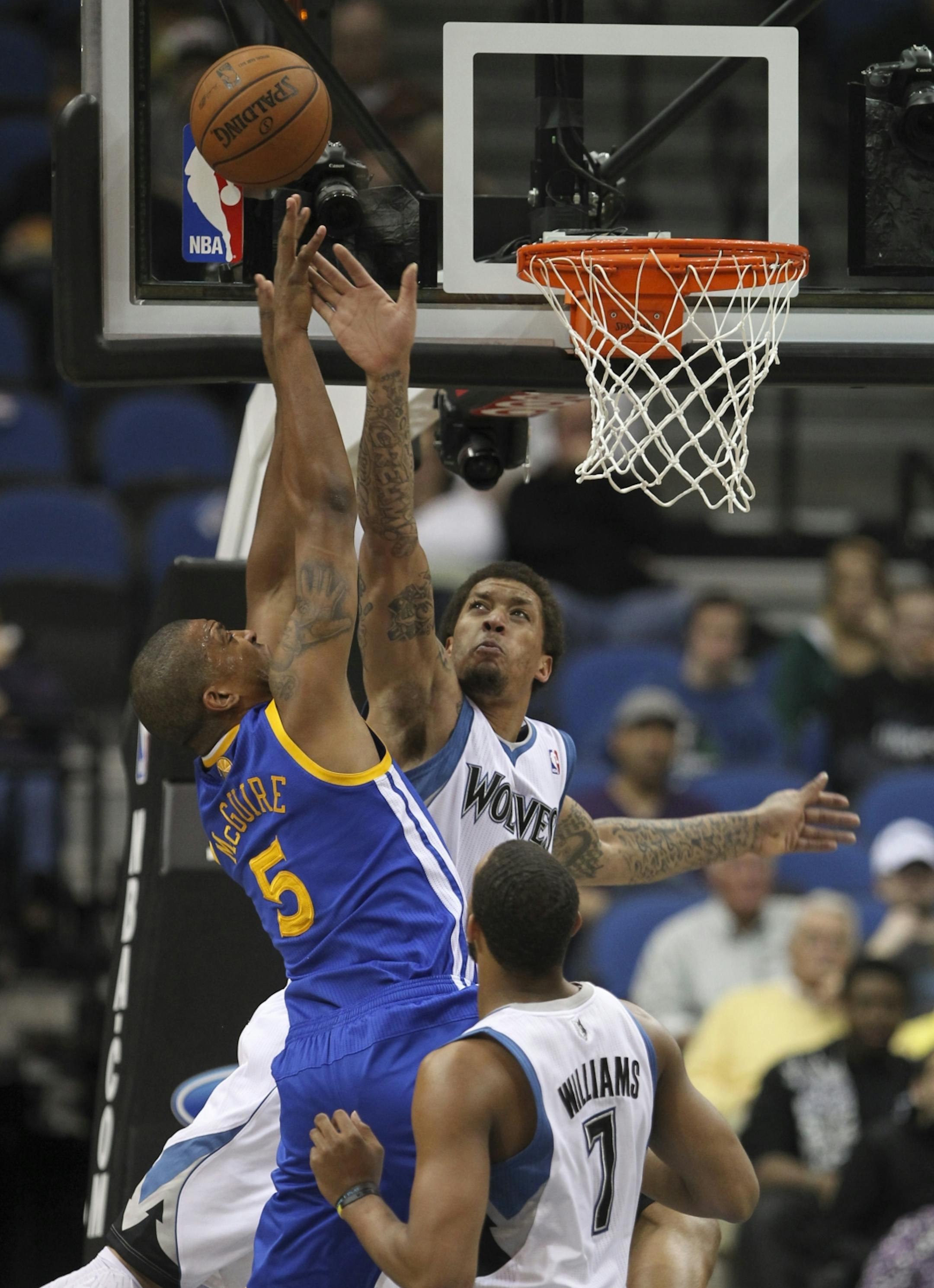 The Minnesota Timberwolves faced the Golden State Warriors in an NBA basketball game Sunday evening, April 22, 2012 at Target Center in Minneapolis, Minn. The Wolves' Michael Beasley fouled the Warriors' Dominic McGuire as he took a second quarter shot.