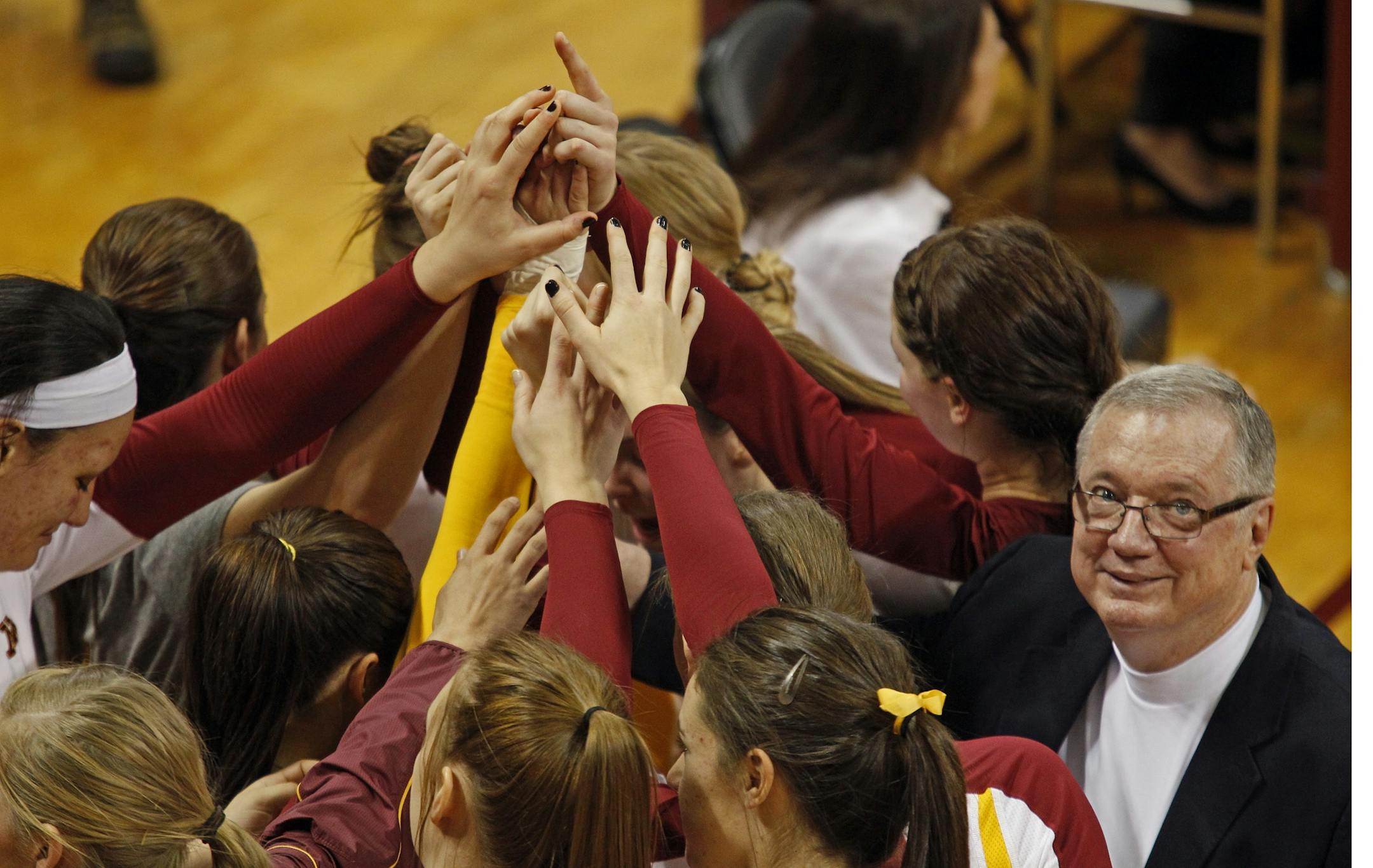 In 15 seasons as coach, Mike Hebert, right, guided the Gophers to 381 victories and three Final Fours, including one appearance in the national championship match.