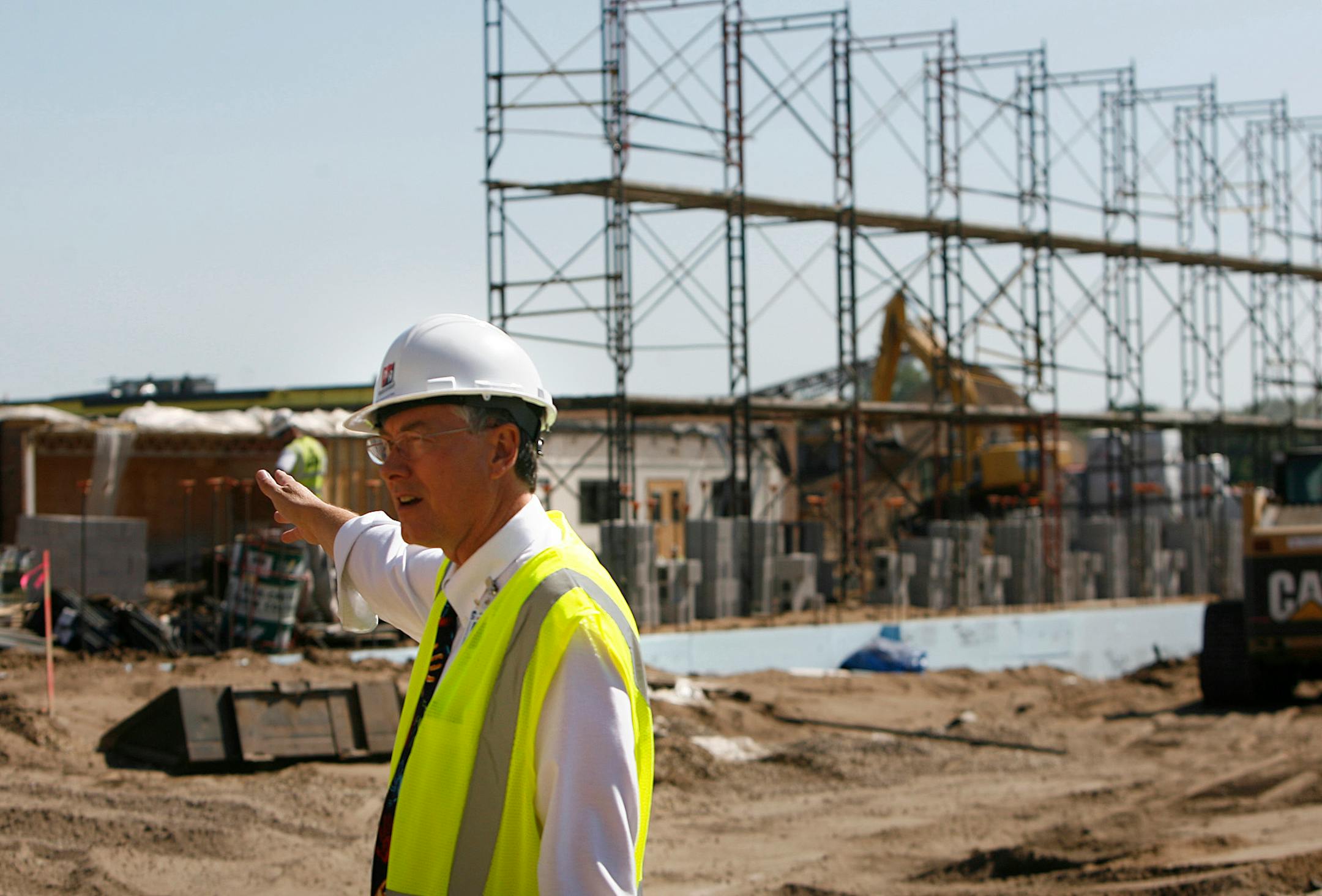 Superintendent Don Helmstetter pointed out the area where a one-story building was demolished and where the current construction of a two-story section of Spring Lake High School is in progress. The school is one of many in the district that are going through phases of remodeling and construction.