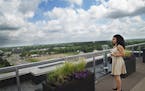 At One Southdale Apartments in Edina, leasing consultant Irma Reyes who just moved here from Chicago checks out the rooftop deck as well as a two-bedr