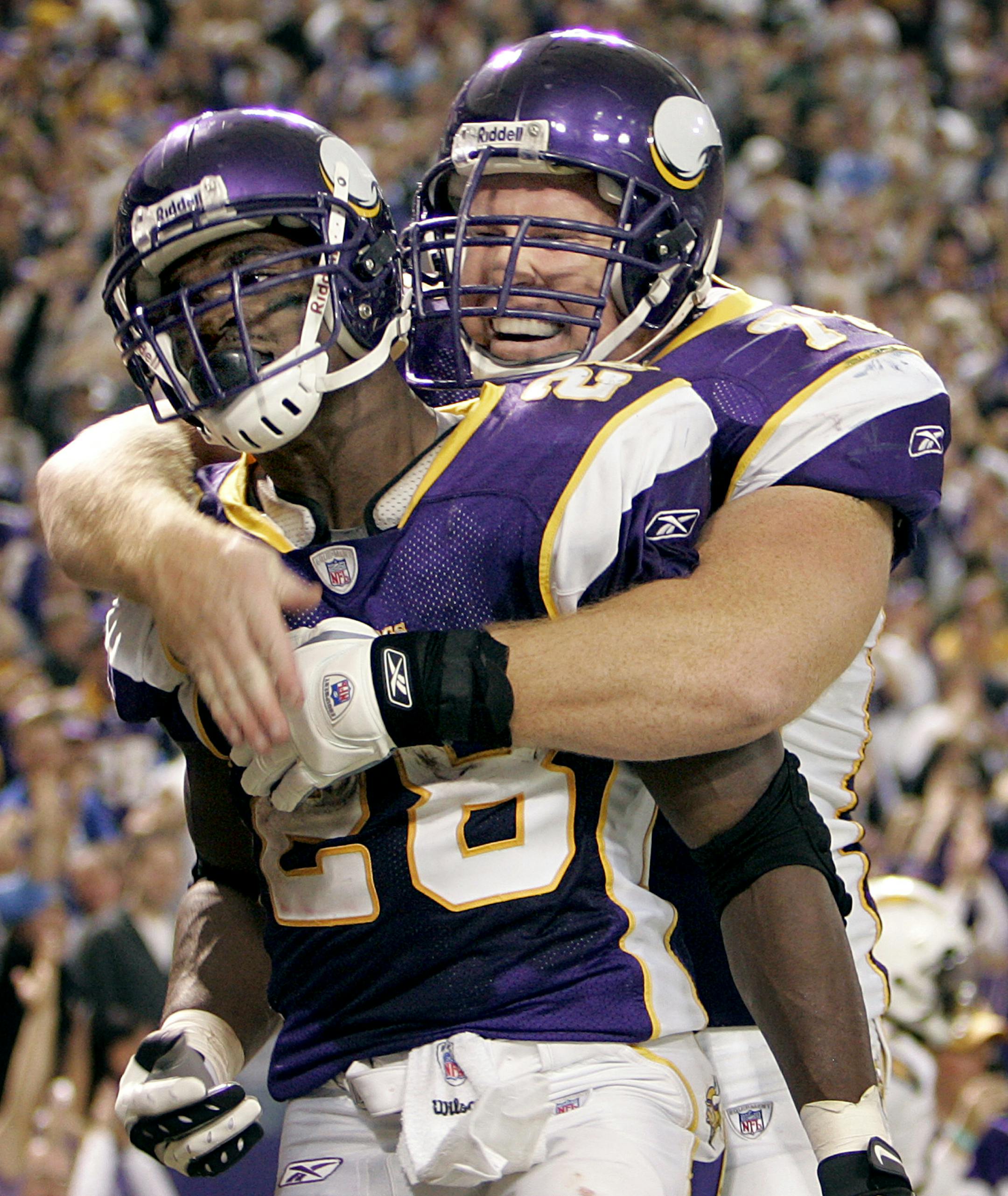 CARLOS GONZALEZ ï cgonzalez@startribune.com November 4, 2007 ñ Minneapolis, MN ñ The Metrodome ñ NFL ñ Minnesota Vikings vs. San Diego Chargers ñ Minnesota running back Adrian Peterson, (28) celebrated with Matt Birk after scoring on a 46-yard run in the third quarter. Adrian Peterson set an NFL single game rushing record with 296 total yards. Minnesota beat San Diego by a final score of 35-17.