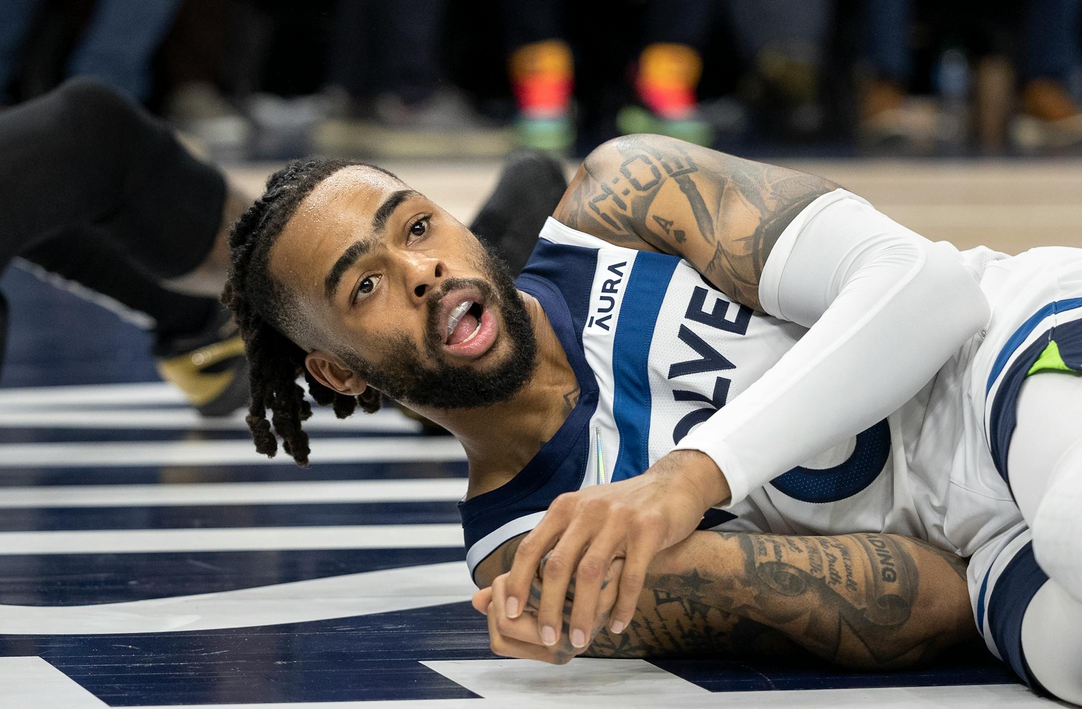D'Angelo Russell (0) of the Minnesota Timberwolves on the floor after being called for a foul in the second quarter.
