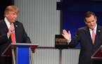 Republican presidential candidate, businessman Donald Trump speaks as Republican presidential candidate, Sen. Ted Cruz, R-Texas, looks on during the F
