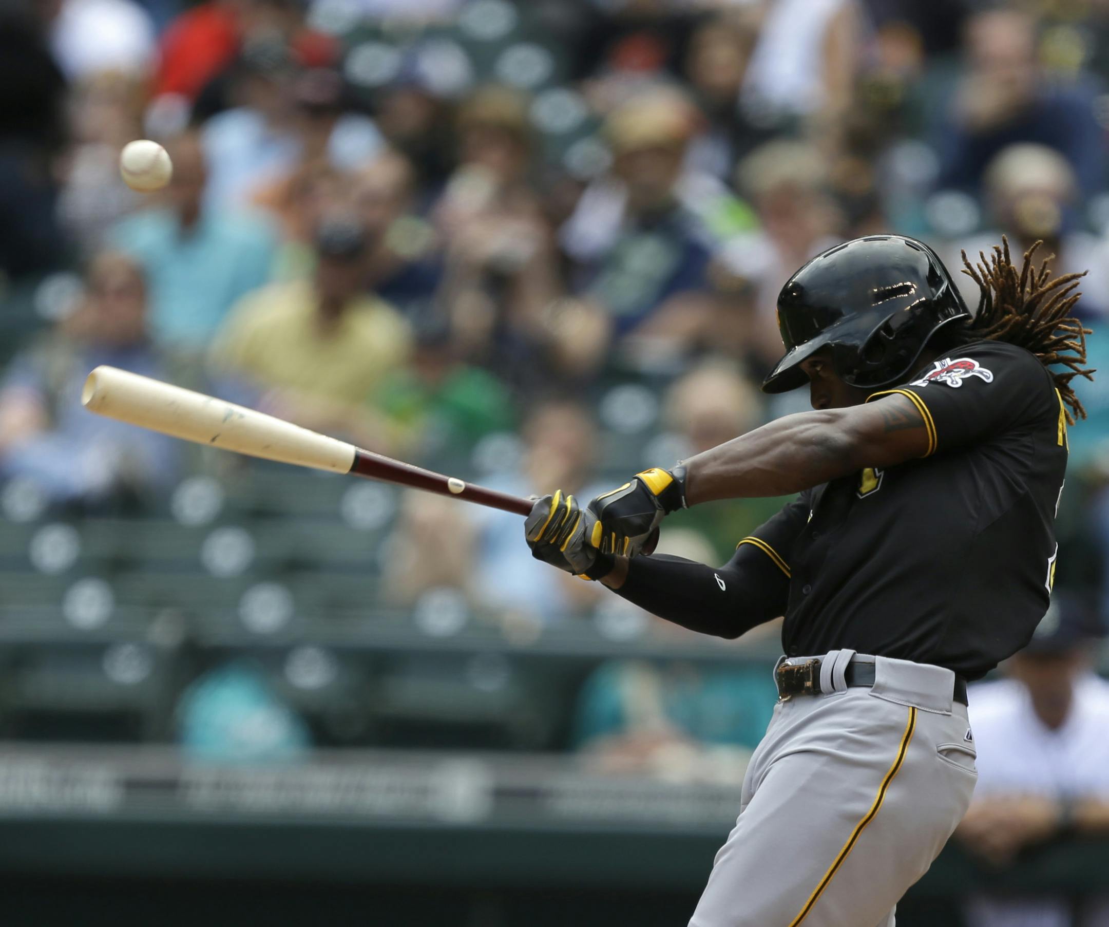 Pittsburgh Pirates' Andrew McCutchen hits a foul ball in the first inning of a baseball game against the Seattle Mariners, Wednesday, June 26, 2013, in Seattle. (AP Photo/Ted S. Warren)