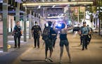 Crowds clashed with police, smashed windows and looting occurred in downtown Minneapolis after a report of a man's death on Nicollet Mall. ] LEILA NAV
