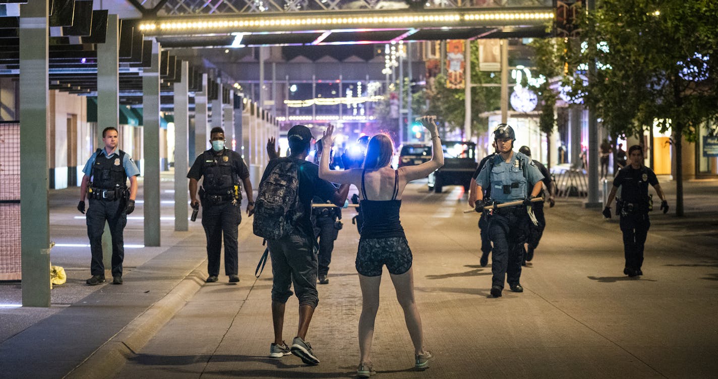 Crowds clashed with police, smashed windows and looting occurred in downtown Minneapolis after a report of a man's death on Nicollet Mall. ] LEILA NAVIDI • leila.navidi@startribune.com BACKGROUND INFORMATION: Crowds clashed with police, smashed windows and looting occurred in downtown Minneapolis on Wednesday, August 26, 2020. The crowds came after a report of a man's death on Nicollet Mall. Police responded by saying he was a homicide suspect who shot himself, releasing video from city cameras.