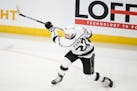 Los Angeles Kings left wing Kevin Fiala (22) attempts a shot against the Minnesota Wild Saturday, Oct. 15, 2022 at the Xcel Energy Center in St. Paul,