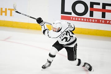 Los Angeles Kings left wing Kevin Fiala (22) attempts a shot against the Minnesota Wild Saturday, Oct. 15, 2022 at the Xcel Energy Center in St. Paul,