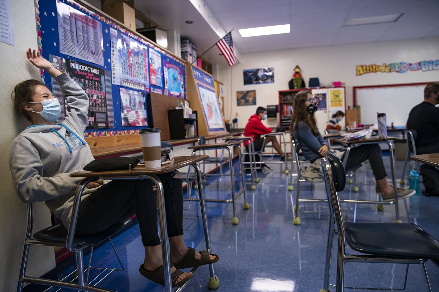 Ella Palmer laughed while raising her hand in Deb Coy's government class for seniors at Carlton High School on Tuesday.