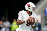 Quarterback Joshua Dobbs looked to throw for the Arizona Cardinals on Oct. 22 in Seattle. The Vikings acquired Dobbs via a trade Tuesday.