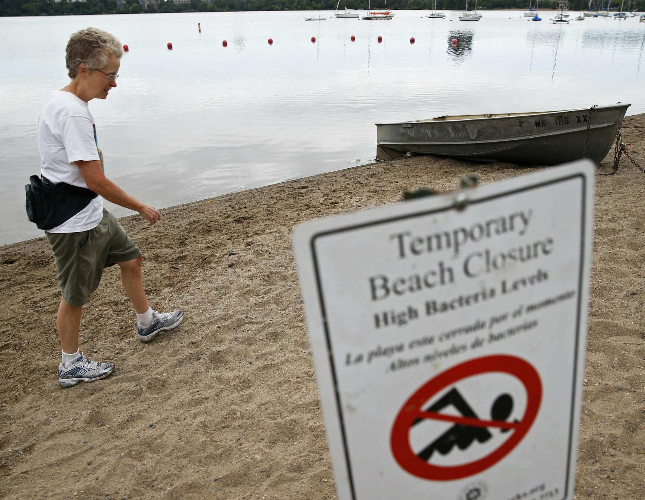 At a 32nd St. swimming beach on Lake Calhoun, the waters are off limits to swimmers due to the high bacteria count. Claudia McMullen does not swim here but this will not deter her from swimmming in Cedar Lake and Lake Harriet.] tsong-taataarii@startribune.com