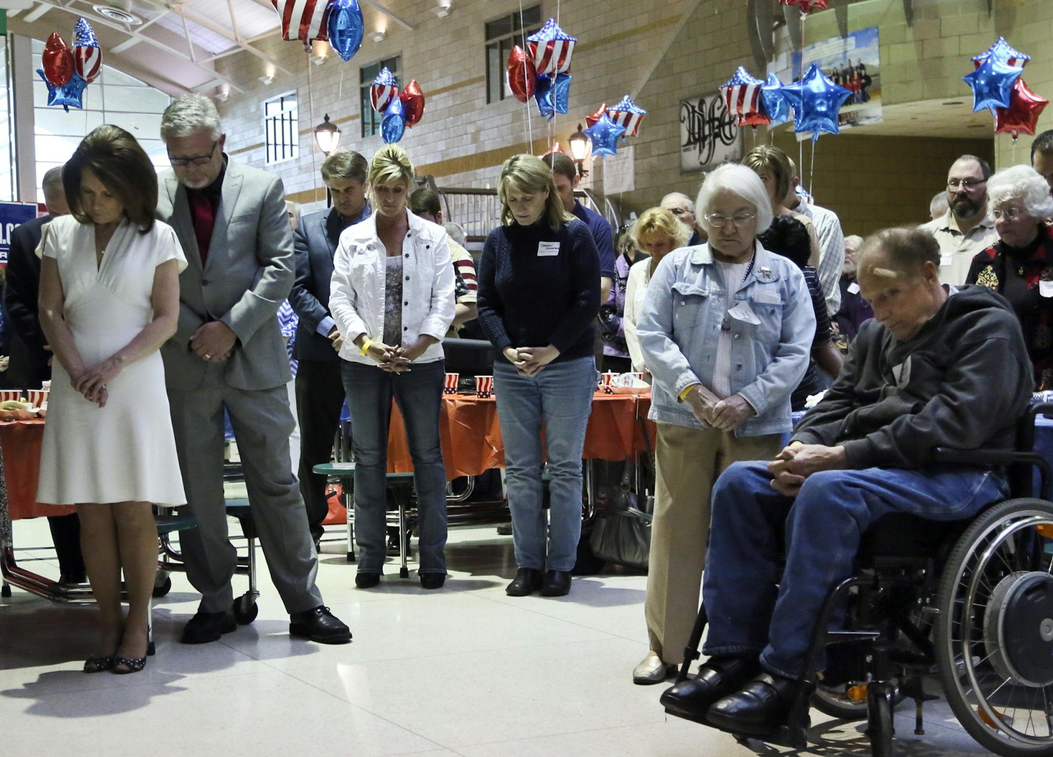 Not one she shy away from her strong Christian beliefs, U.S. Rep.Michele Bachmann bowed her head in prayer along with supporters and her husband Marcus, to her right, and her mother, Jean LaFave, to her left, during a tribute to Bachmann at Monticello High Friday, April 11, 2014, in Monticello, MN.](DAVID JOLES/STARTRIBUNE) djoles@startribune.com Michelle Bachman, the outgoing firebrand, is still raising money for her Political Action Committee and she continues to tirelessly canvas the country