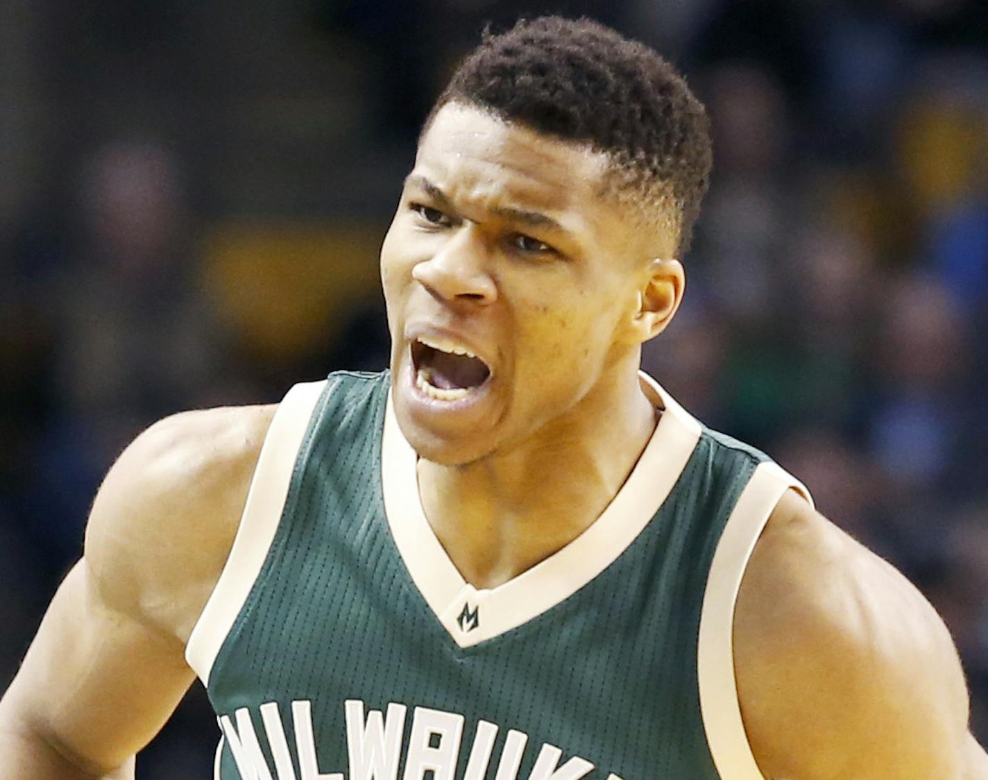 Milwaukee Bucks forward Giannis Antetokounmpo (34) reacts after hitting a basket during the first half of an NBA basketball game against the Boston Celtics, Wednesday, March 29, 2017, in Boston. (AP Photo/Mary Schwalm)