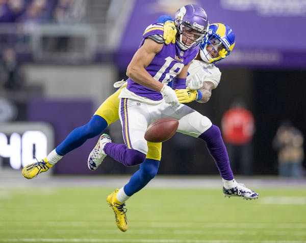 Rams cornerback Jalen Ramsey (5) contested a pass intended for Vikings wide receiver Justin Jefferson (18) in the third quarter.