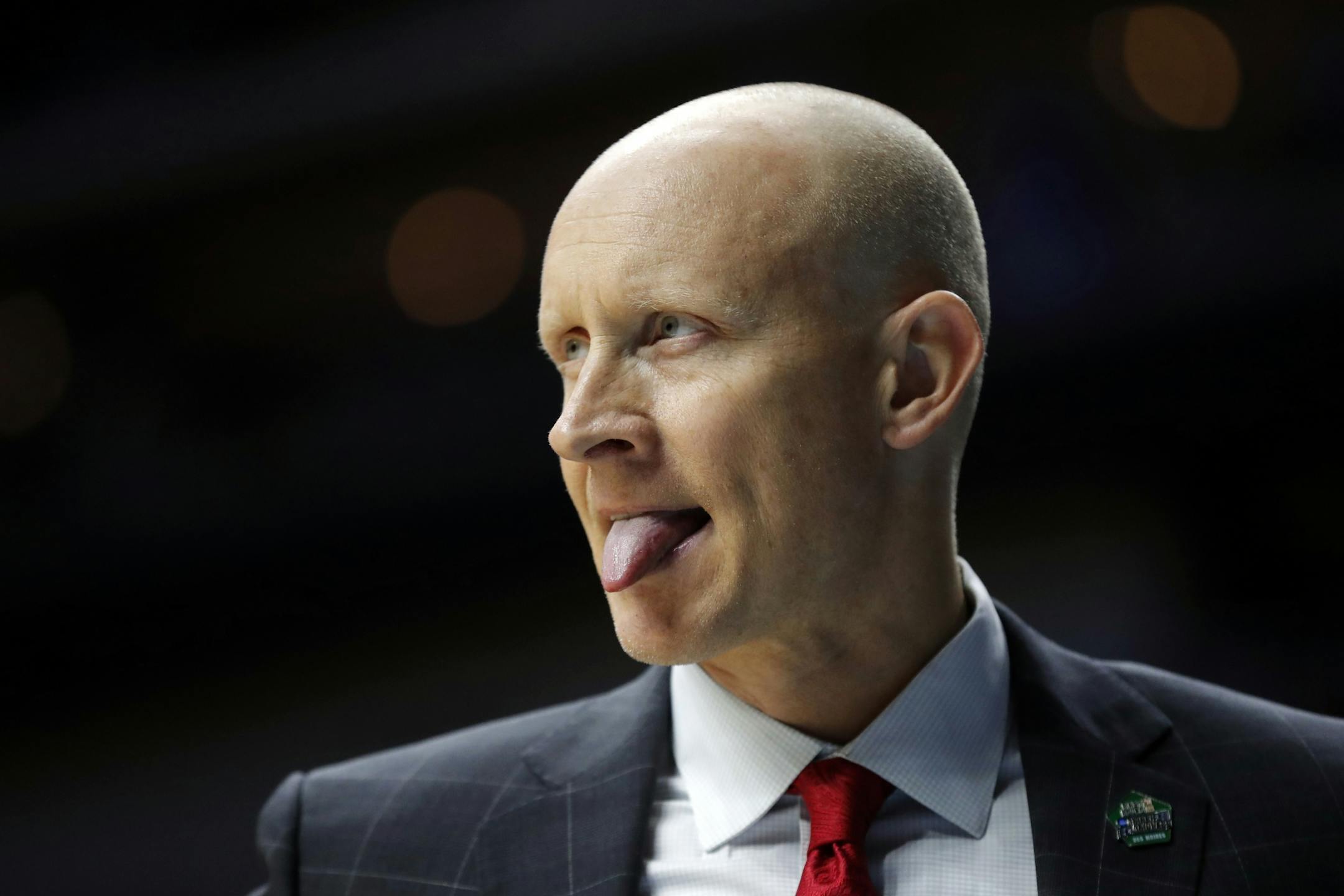 Louisville head coach Chris Mack watches from the bench during a first round men's college basketball game against Minnesota in the NCAA Tournament, Thursday, March 21, 2019, in Des Moines, Iowa.