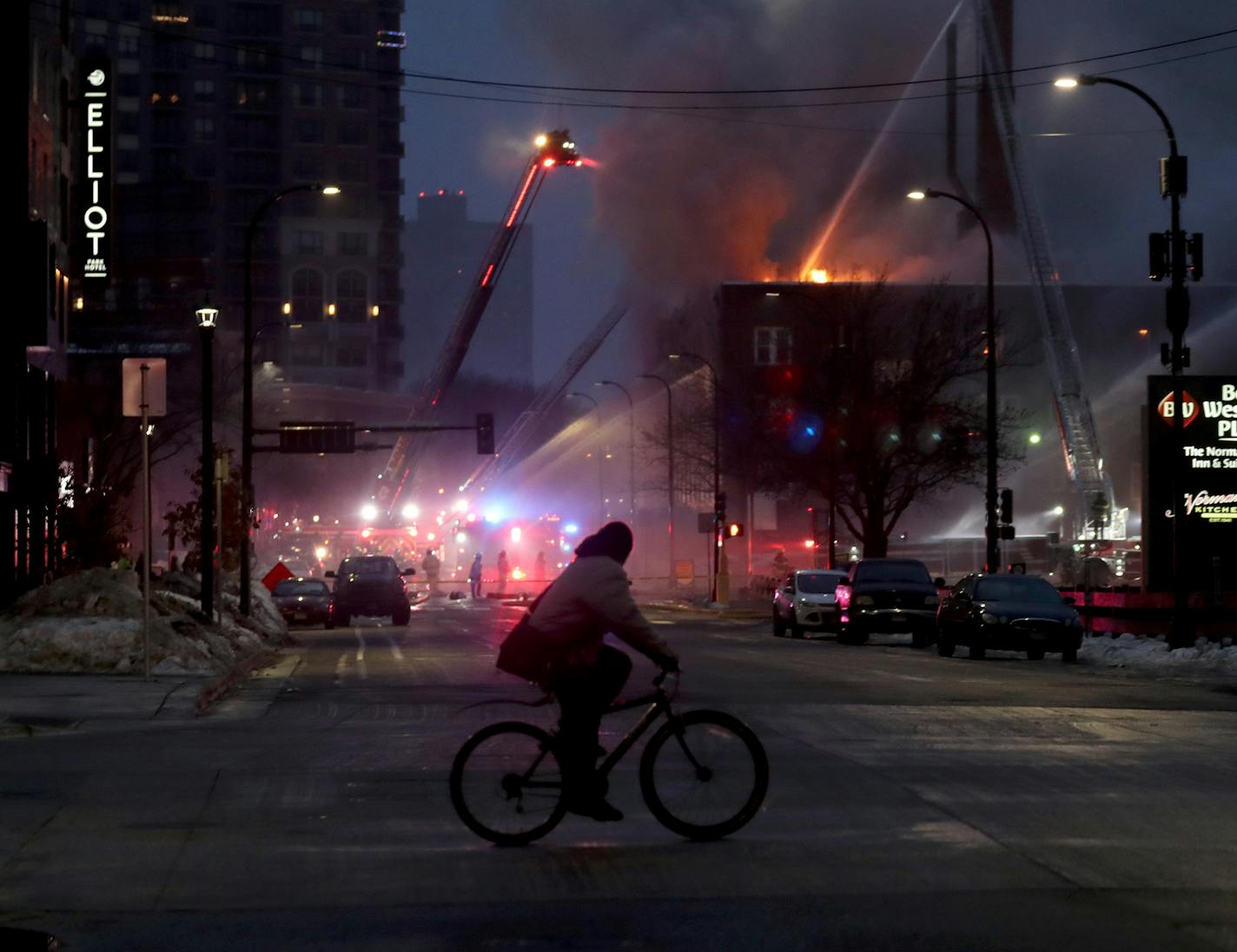 Firefighters continued to work early Wednesday to put out a four-alarm fire at the Francis Drake Hotel apartments in downtown Minneapolis.