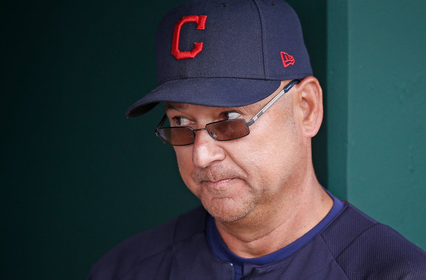 Cleveland Indians manager Terry Francona pauses in the dugout prior to a spring training baseball game against the San Diego Padres Sunday, March 5, 2017, in Goodyear, Ariz. The Indians defeated the Padres 8-2. (AP Photo/Ross D. Franklin)