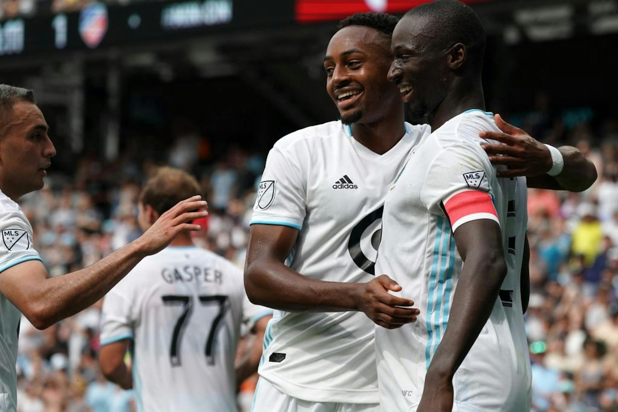 Minnesota United defender Ike Opara (3) was congratulated by Minnesota United forward Mason Toye (23) after he scored in the second half.