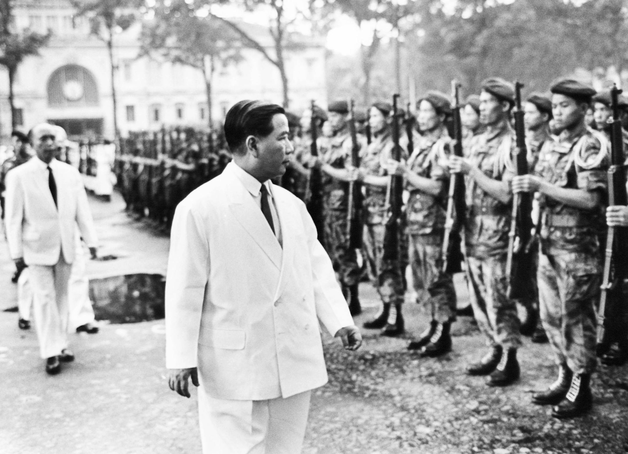 Presiden Ngo Dinh Diem reviewing the guards of Airforce, Navy, Marines and paras, representing the Army on July 8, 1963. Behind him are Buddhist Vice President Nguyen Ngoc of Diems Government and Vietnam Joint Chief of staff of Vietnamese Army General Le Van Ty. (AP Photo/ Horst Fass) ORG XMIT: APHS311045
