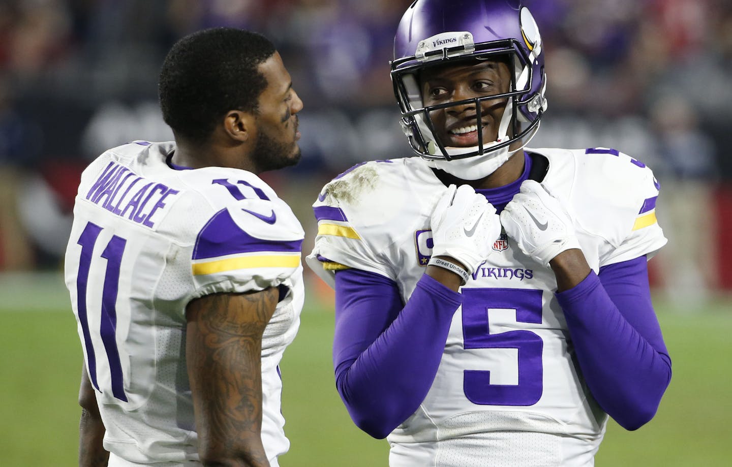 Minnesota Vikings quarterback Teddy Bridgewater (5) talks with Minnesota Vikings wide receiver Mike Wallace (11) during the second half of an NFL football game against the Arizona Cardinals, Thursday, Dec. 10, 2015, in Glendale, Ariz. (AP Photo/Ross D. Franklin)