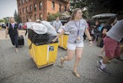 Sophomore Hannah Smith helped first-year students move into the dorms at the University of St. Thomas on Friday.
