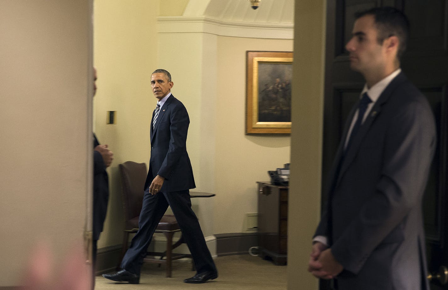 President Barack Obama arrives at the Oval Office to sign letters commuting the criminal sentences of 95 federal prisoners and pardon two others, at the White House in Washington, Dec. 17, 2015. The vast majority of the commutations are for nonviolent drug offenders who have been in prison for over a decade; forty prisoners serving life sentences will be freed. (Stephen Crowley/The New York Times) ORG XMIT: MIN2015123013334971