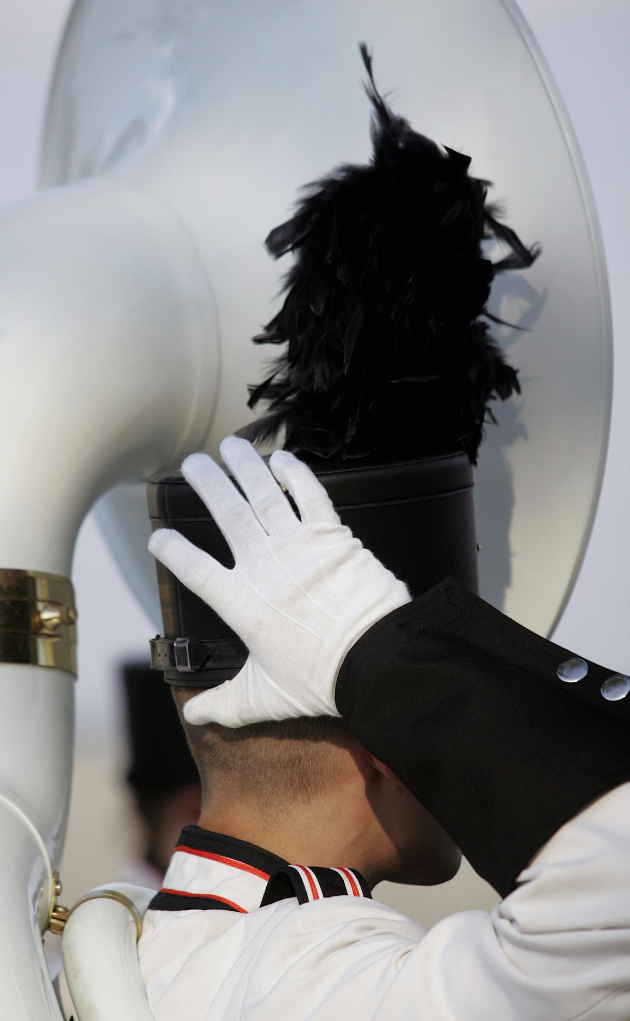 JENNIFER SIMONSON • jsimonson@startribune.com
Brooklyn Park, MN-June 14, 2007
An Osseo High School marching band member adjusted his hat prior to a performance in the Tater Daze Parade. The band, along with a dozen other high school bands, will compete in a street marching competition in Osseo on June 23. GENERAL INFORMATION: The Osseo High School marching band will be preparing to march in the Tater Daze parade later this evening.