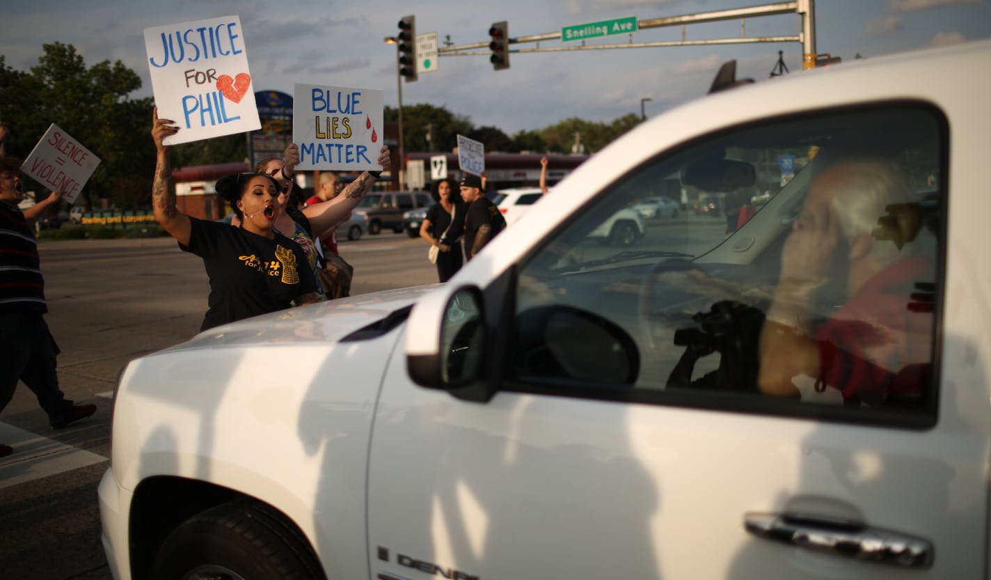 Demonstrators tried to block a driver who grew impatient as they stopped traffic heading north on Snelling Ave. for a short while. ] JEFF WHEELER &#xef; jeff.wheeler@startribune.com A vigil for Philando Castile took place Monday evening, August 29, 2016 outside the Minnesota State Fair. Two groups, Merriam Park Neighbors for Peace and St. Paul Eastside Neighbors for Peace, gathered at the site on Larpenteur Ave. near Snelling Ave. where Castile was fatally shot by a St. Anthony police officer in