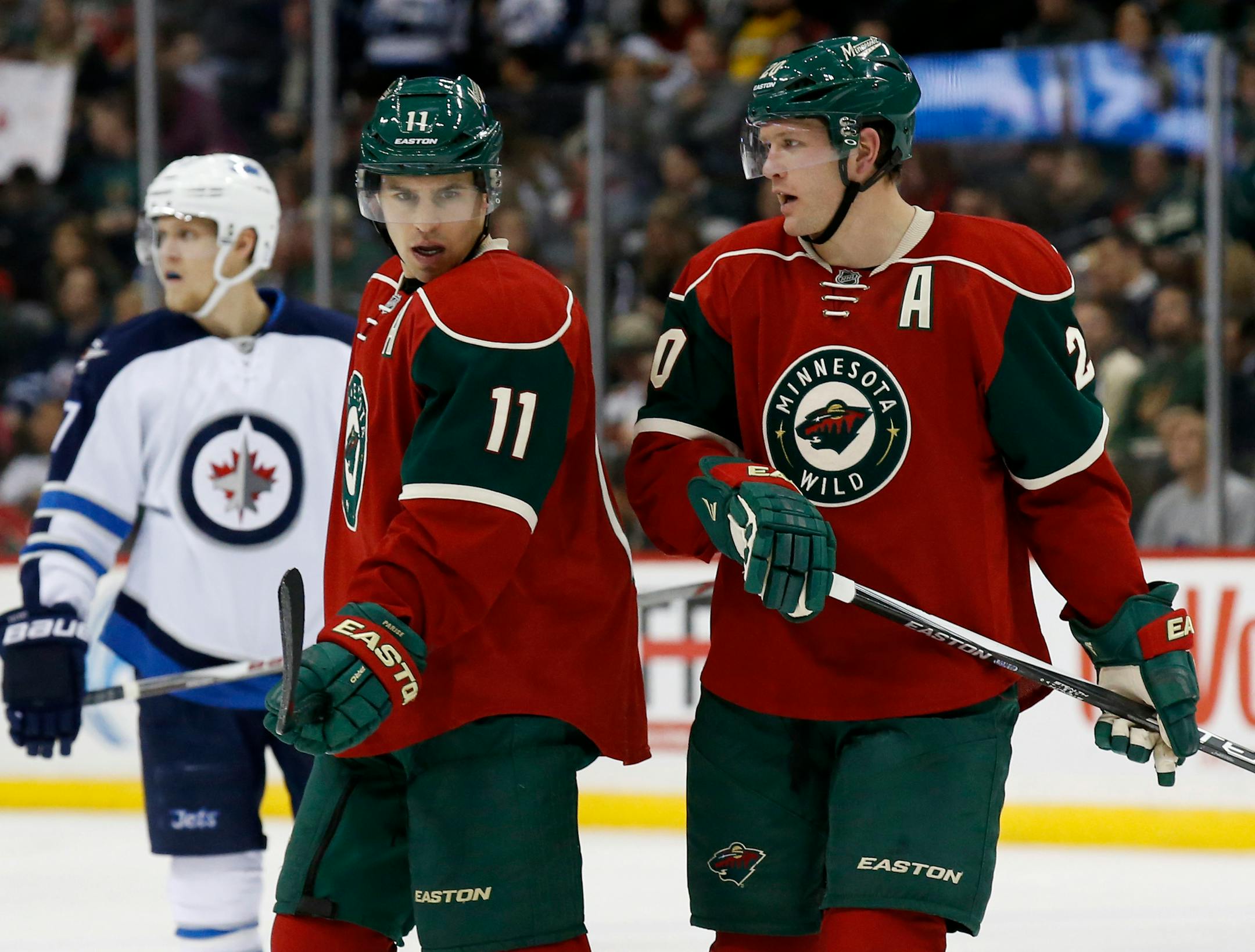 In this Nov. 27, 2015, file photo, Wild left wing Zach Parise talks with defenseman Ryan Suter. The two are linked as the players who lifted the Wild franchise's profile around the league